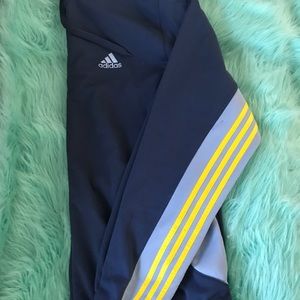 Navy blue Adidas jacket with yellow stripes